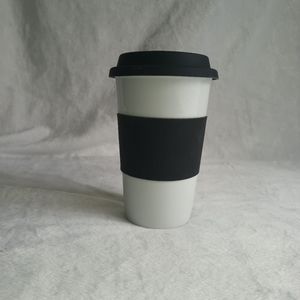 William Sonoma Porcelain Tumbler with Silicone lid and Sleeve Band